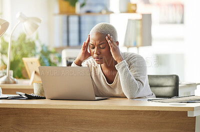 Buy stock photo Shot of a young businesswoman looking stressed out while sitting at her desk