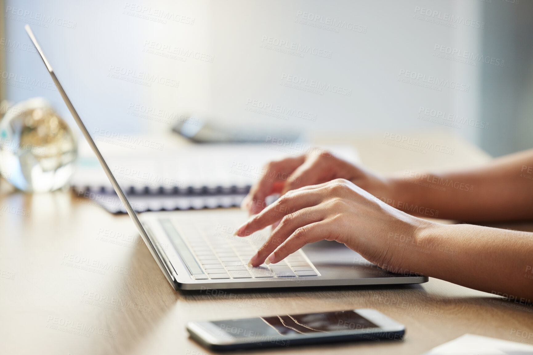 Buy stock photo Shot of a businesswoman working on her laptop in her office