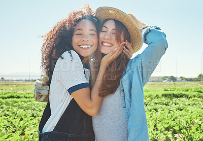 Buy stock photo Shot of two female farmers working together