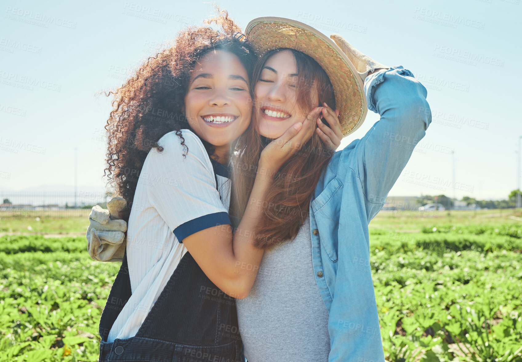 Buy stock photo Shot of two female farmers working together