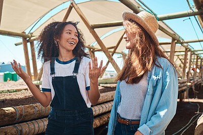 Buy stock photo Shot of two young women working together on a farm