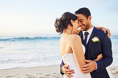 Buy stock photo Wedding day, hug and couple at a beach for love, union and celebration against a nature background. Summer, marriage and happy groom with bride embracing at sea ceremony, smile and romantic in Bali