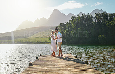 Buy stock photo Love, couple and dance at lake pier, smile or bonding outdoors on vacation at sunrise. Dancing date, having fun and happy man and woman on anniversary celebration for romantic holiday at summer creek