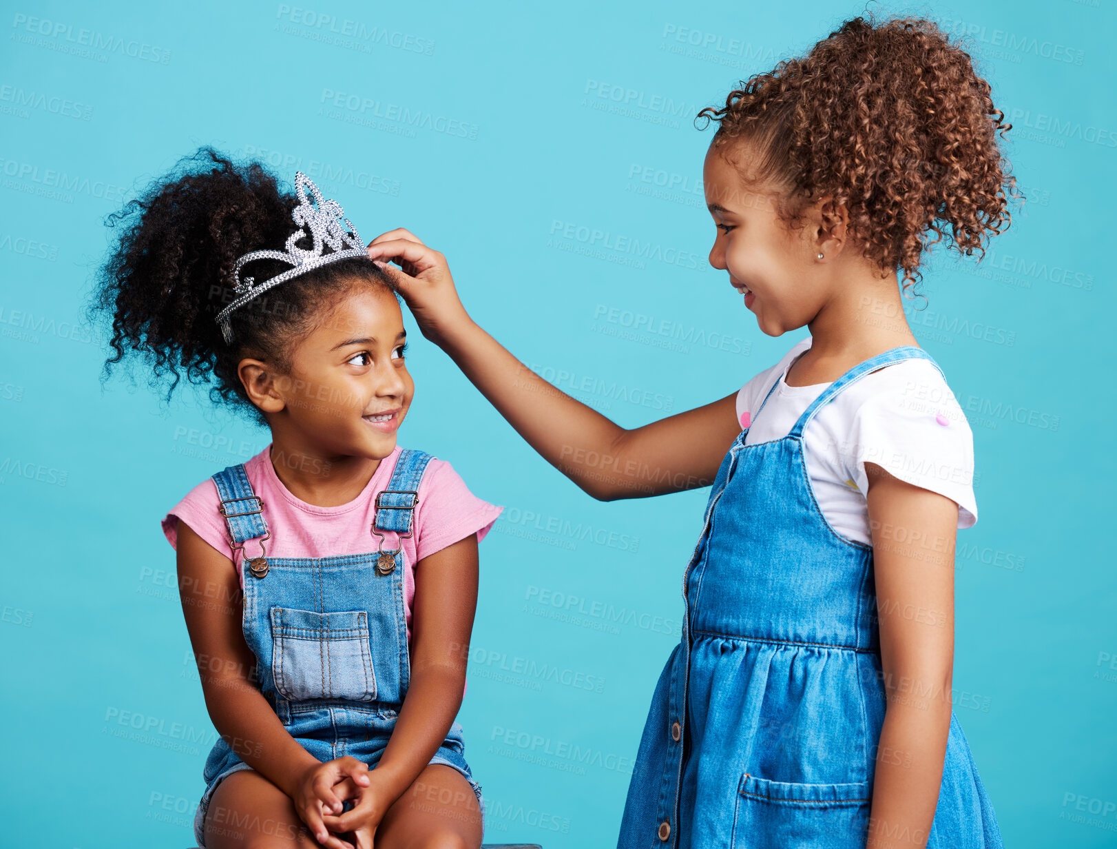 Buy stock photo Princess crown, happy friends and children in studio with a fantasy game with happiness, Isolated, blue background and dress up of a little girl and child friend with a smile of siblings and kids