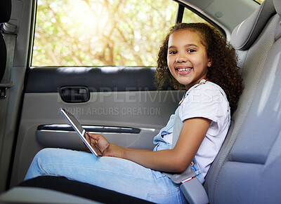 Buy stock photo Car ride, child portrait and tablet with a happy kid in a backseat with transportation travel. Video streaming, smile and happiness of a girl on road trip and adventure for holiday riding in vehicle 