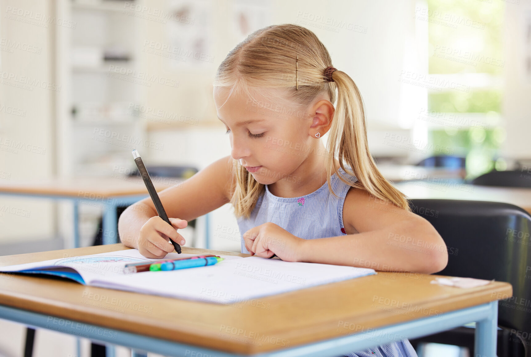 Buy stock photo Education, drawing and girl in classroom learning, exam or studying with book. Preschool, development and serious kid and student with creative art in notebook, writing and knowledge in kindergarten.