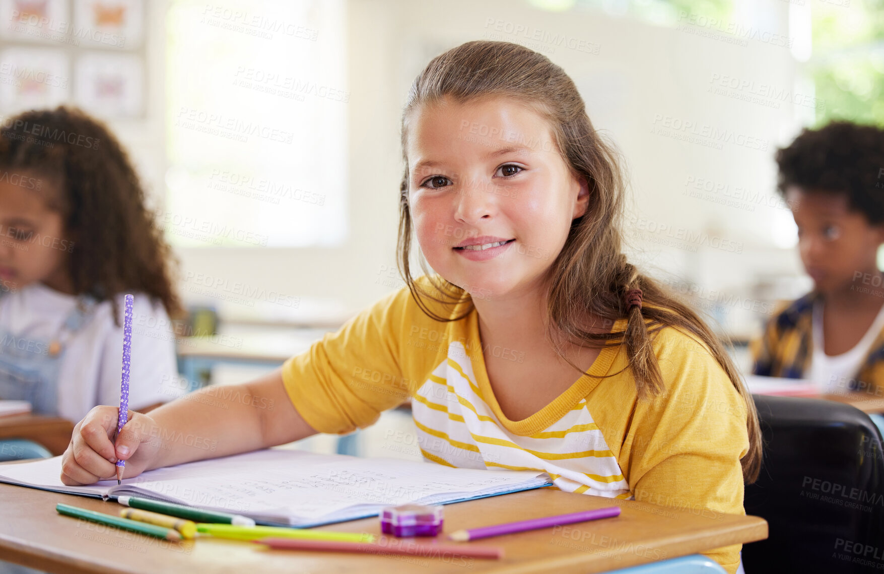 Buy stock photo Education, writing and portrait of girl in classroom learning, exam or studying with book. Preschool smile, development and happy kid or student write notes for knowledge in notebook in kindergarten.