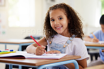 Buy stock photo Learning, drawing and portrait of girl in classroom exam, education or studying with book. Preschool smile, development and happy kid or student coloring for creative art in notebook in kindergarten.