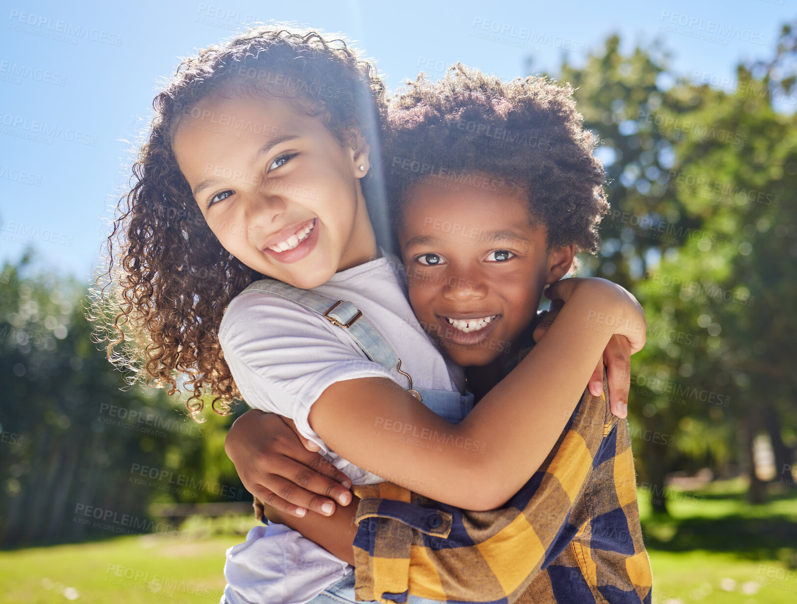 Buy stock photo Portrait, kids and friends hugging in a park together for fun, bonding or playing in summer. Hug, children or diversity with girl and boy best friends embracing in a garden during the day