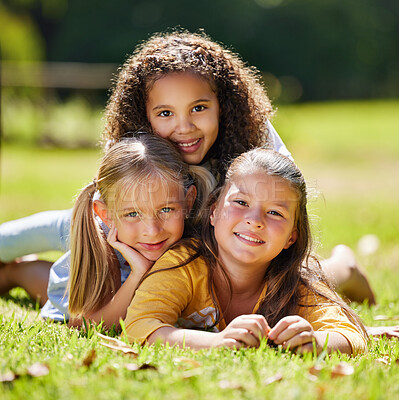 Buy stock photo Summer, girls portrait or happy kids on grass in park together for fun, bonding or playing in nature. Smile, diversity or young best friends smiling or embrace on school holidays in outdoor field