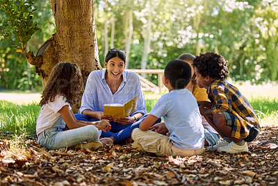 Buy stock photo Teacher reading, tree or children with book for learning development, storytelling or growth in park. Smile, youth or happy educator with stories for education at a kids kindergarten school in nature