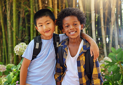 Buy stock photo Friends, children and portrait outdoor in nature for field trip in summer with diversity and happiness. Asian and black boy kids together in a forest for adventure and summer trip with a backpack