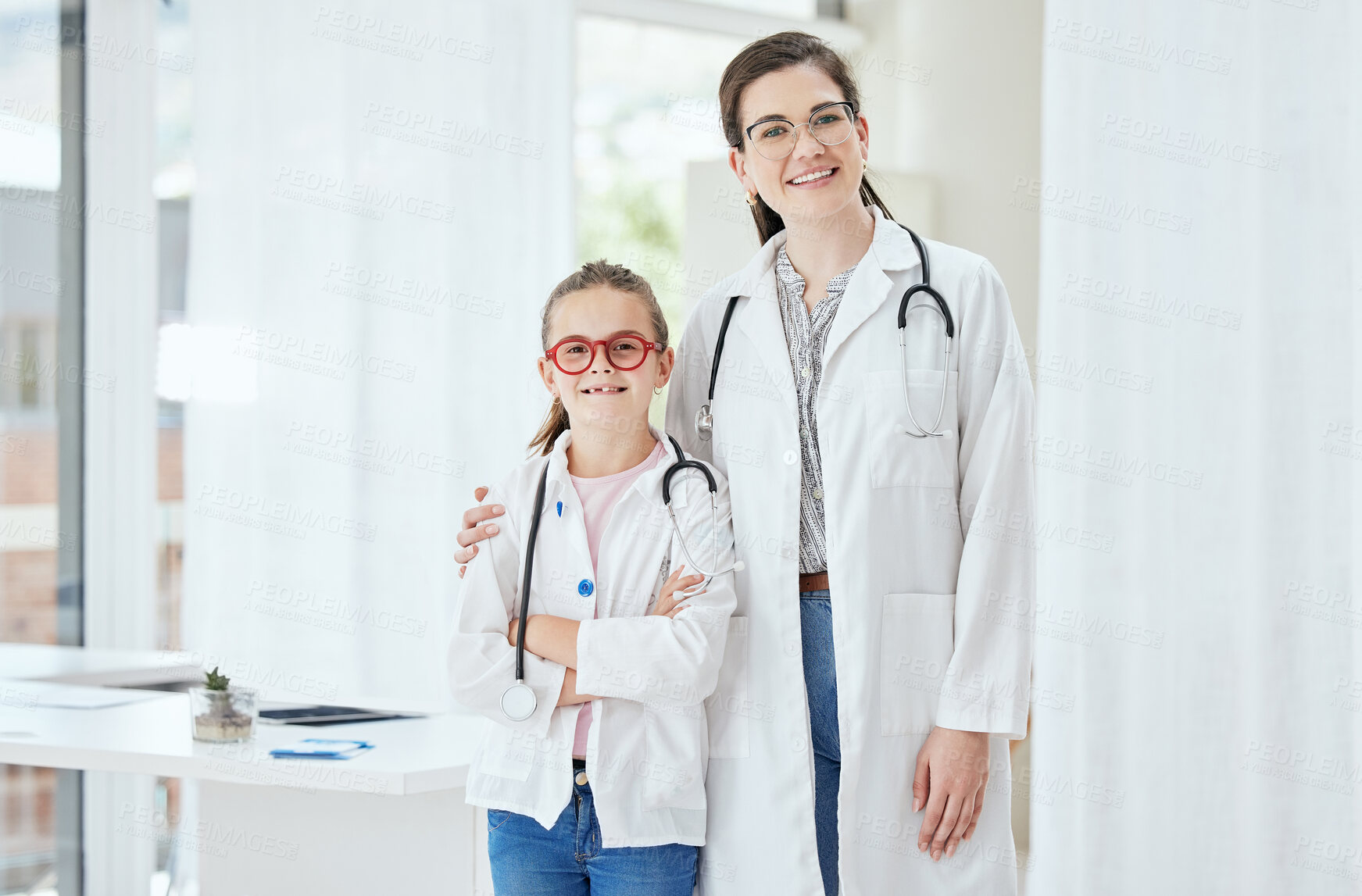 Buy stock photo Portrait, doctor and girl with smile for career day in hospital with confidence for healthcare and future. People, education and smile at clinic for dressing up as professional for job shadowing