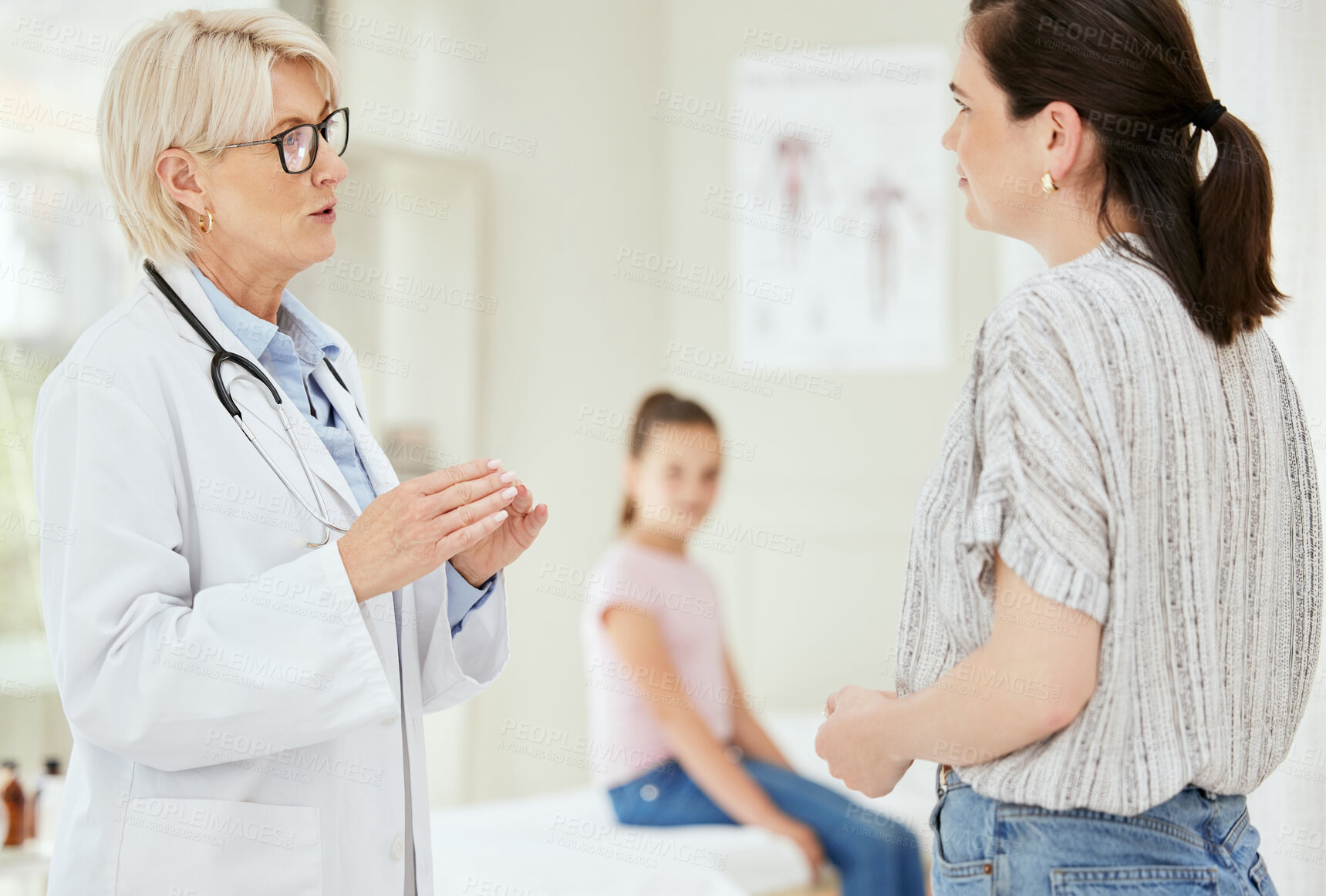 Buy stock photo Doctor, woman and talk in clinic for healthcare, medical advice and professional opinion for child wellness. Pediatrician, mother or discussion in consultation for kid recovery, diagnosis or medicare