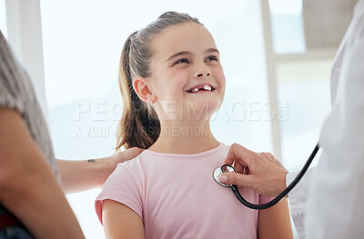 Buy stock photo Shot of a little girl getting a checkup at a hospital