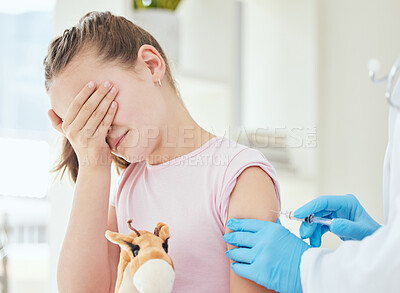 Buy stock photo Shot of an unrecognizable doctor giving a little girl an injection at a hospital