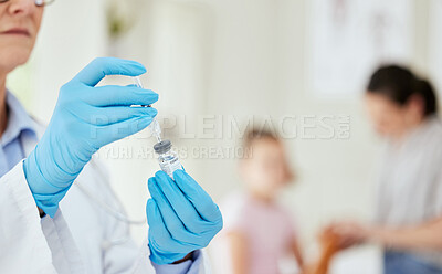 Buy stock photo Shot of an unrecognizable doctor preparing a vaccine at a hospital