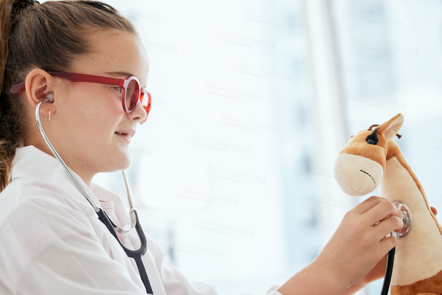 Buy stock photo Pretend, stethoscope and kid doctor with teddy bear in home for fantasy, playing or imagination. Future, healthcare and girl medical worker with giraffe plush toy for cardiology checkup at house.