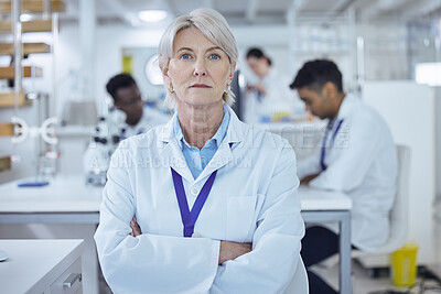 Buy stock photo Shot of a proud mature female scientist in the lab