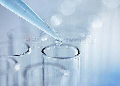 Buy stock photo Shot of an unknown person inserting sample fluid into test tubes