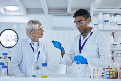 Buy stock photo Shot of two colleagues working together in a lab