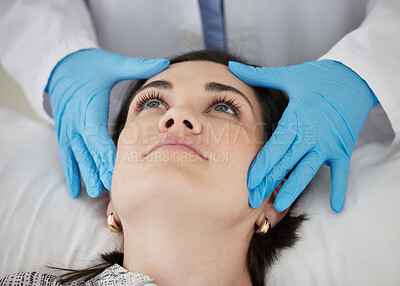 Buy stock photo Shot of a doctor analysing a patients face before injections