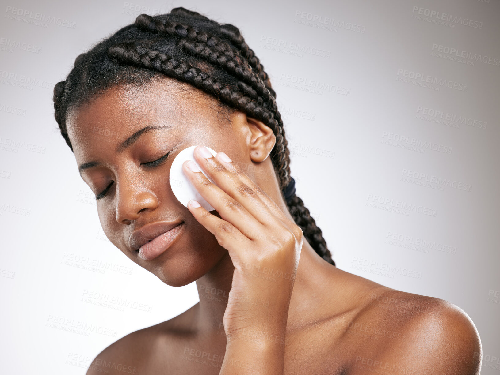 Buy stock photo Beauty, skincare and cotton with face of black woman in studio for cosmetics, toner and facial. Self care, glow and shine with female model on white background for clean, makeup remover and spa