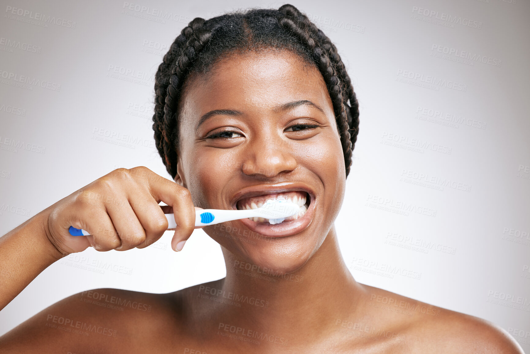 Buy stock photo Dental health, portrait and black woman brushing teeth in studio for gum disease prevention. Oral hygiene, wellness and African person with cleaning teeth routine for fresh breath by gray background.