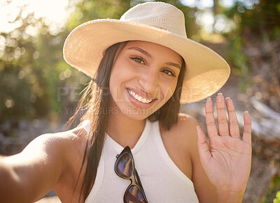 Buy stock photo Shot of a woman waving while spending time outdoors