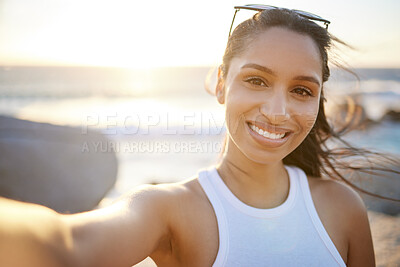 Buy stock photo Shot of a beautiful young woman spending time at the beach