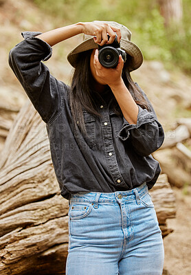 Buy stock photo Woman, photographer and camera to explore outdoor, hiking and forest for travel journalism. Female person, trekking and capture memory of natural ecosystem, cover face and photography in Indonesia