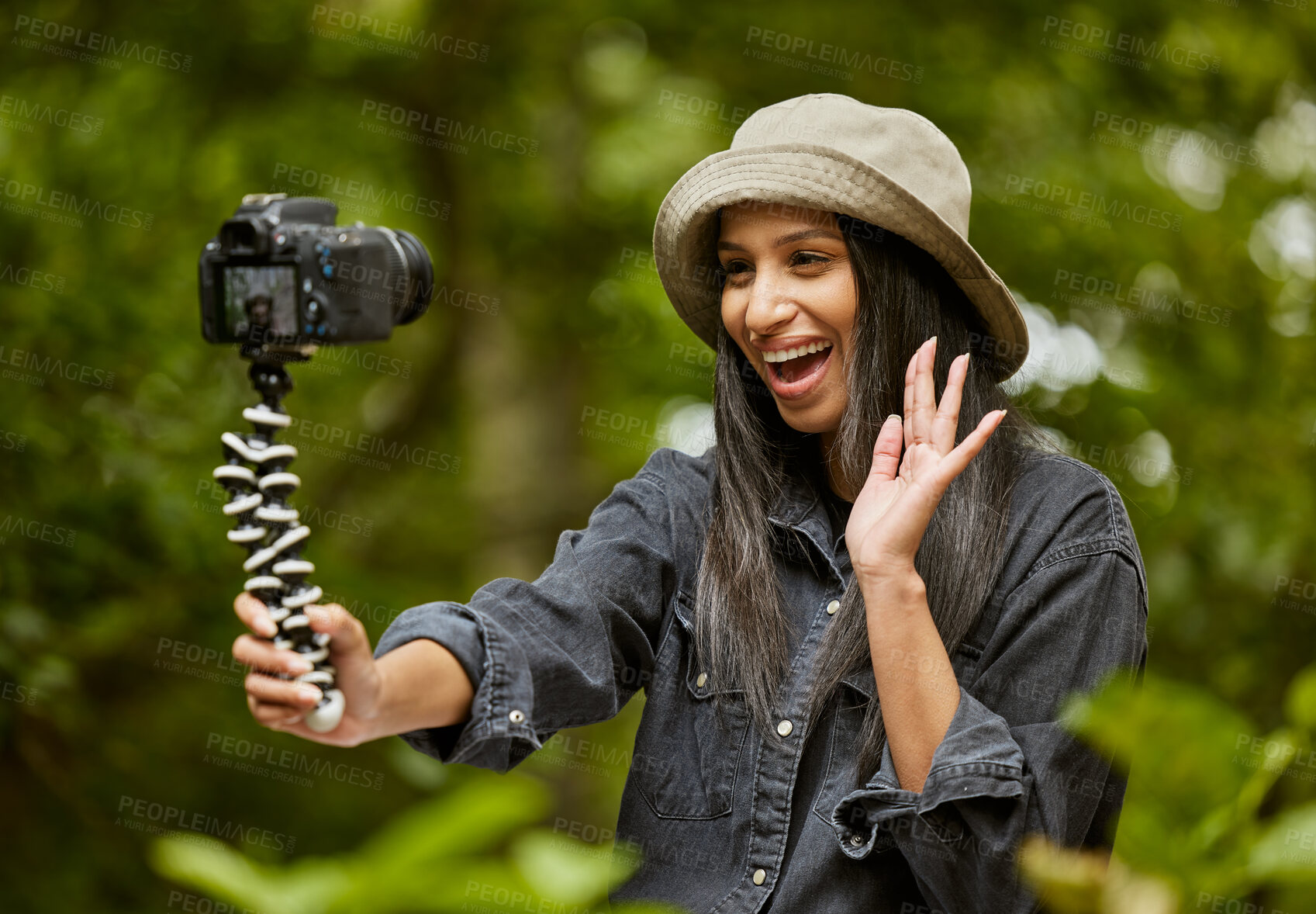 Buy stock photo Woman, holiday and selfie in nature, hiking and forest for travel influencer on vlog. Female person, trekking and capture memory of jungle ecosystem, live streaming and wave hello to online audience