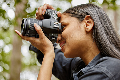 Buy stock photo Woman, photographer and camera to capture nature, hiking and forest for travel journalism. Female person, trekking and capture memory of jungle ecosystem, sightseeing and photography in Indonesia