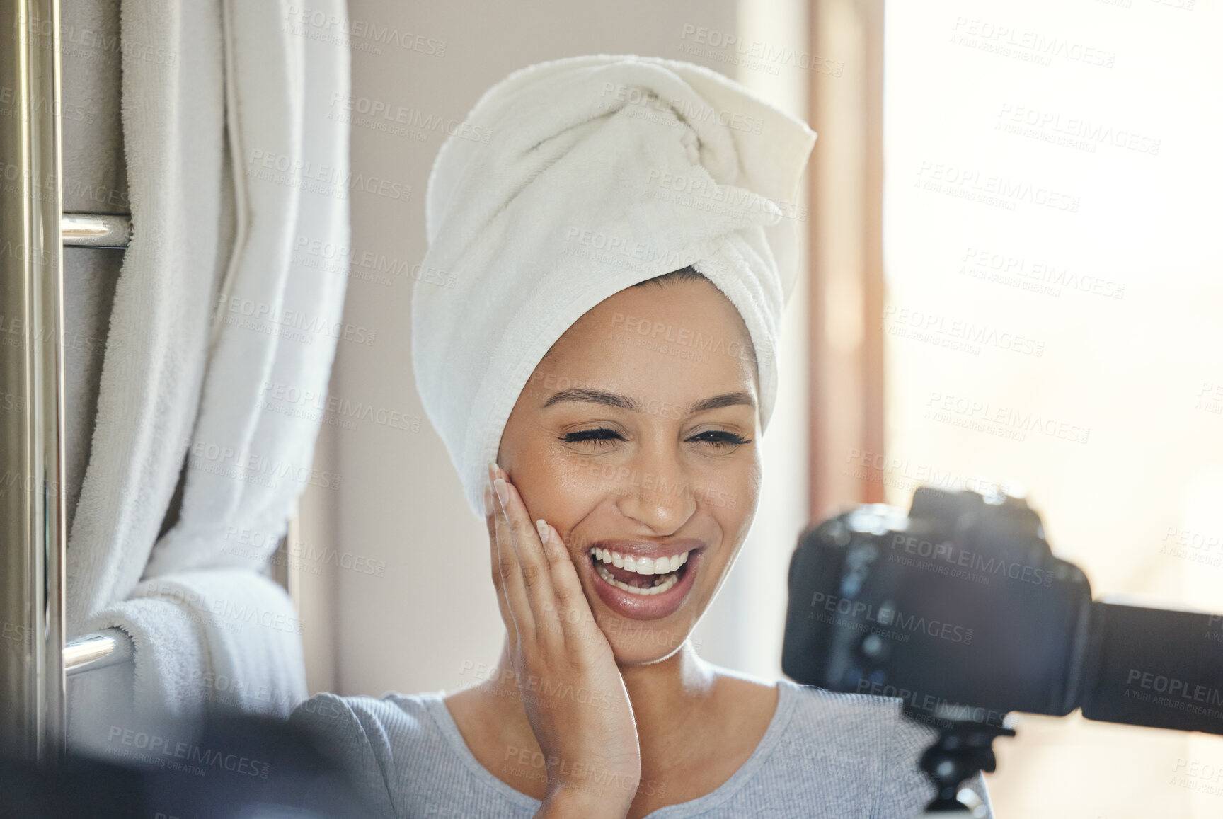 Buy stock photo Shot of a young woman recording herself getting ready at home