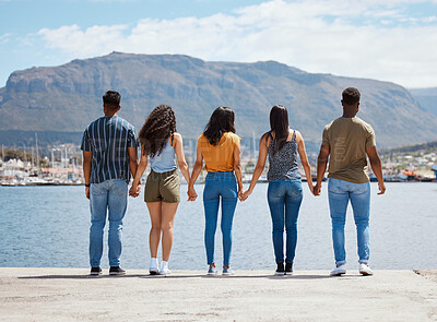 Buy stock photo People, holding hands and outdoor freedom on holiday, reunion and group together for bonding. Friends, weekend and support on adventure for hangout in Monaco, back and waterfront for celebration