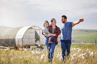 Buy stock photo Shot of a couple and their adorable daughter on a poultry farm