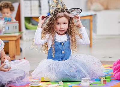 Buy stock photo Shot of a little girl playing dress-up in class