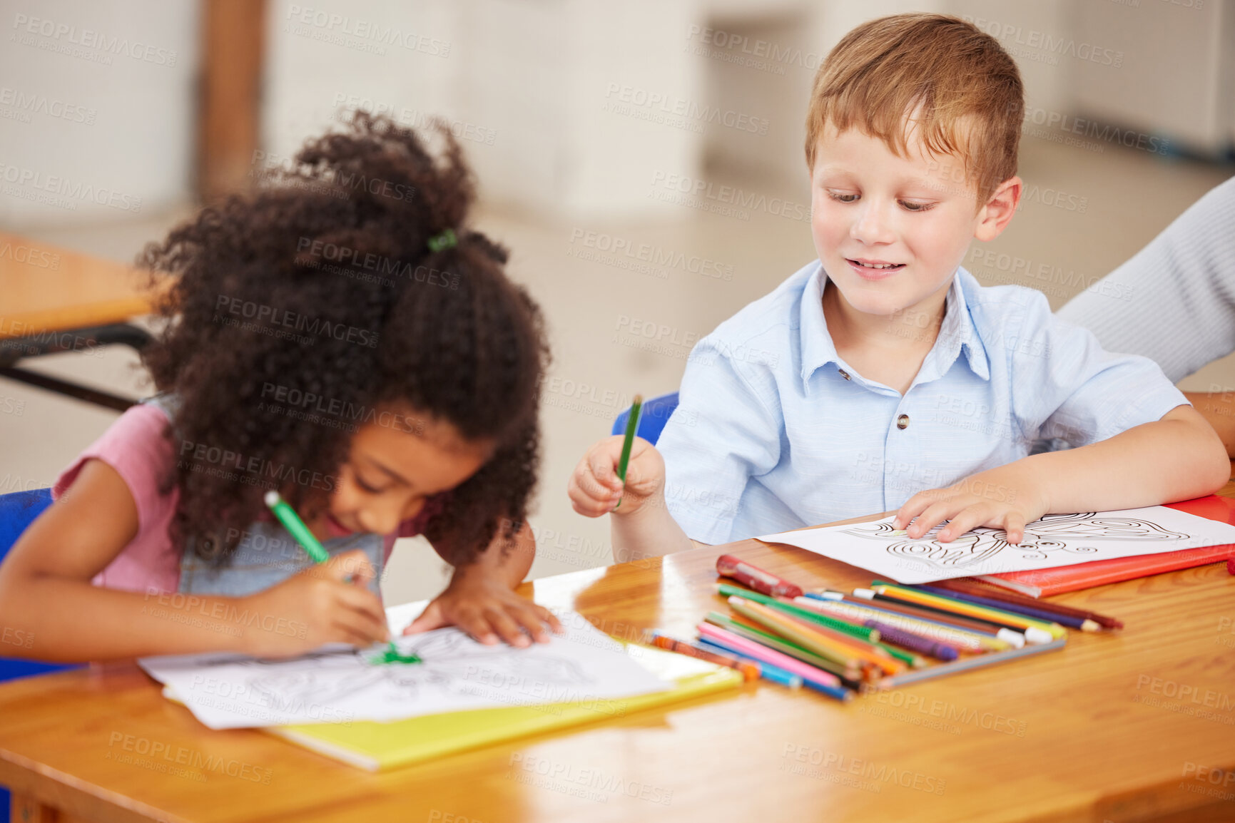 Buy stock photo Shot of preschool students colouring in class