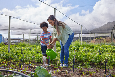 Buy stock photo Full length shot of an attractive young woman and adorable little boy working on a farm