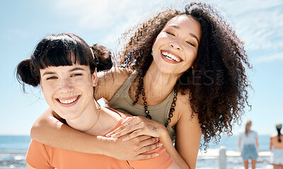 Buy stock photo Shot of an attractive young woman giving her a friend a piggyback ride while bonding outside