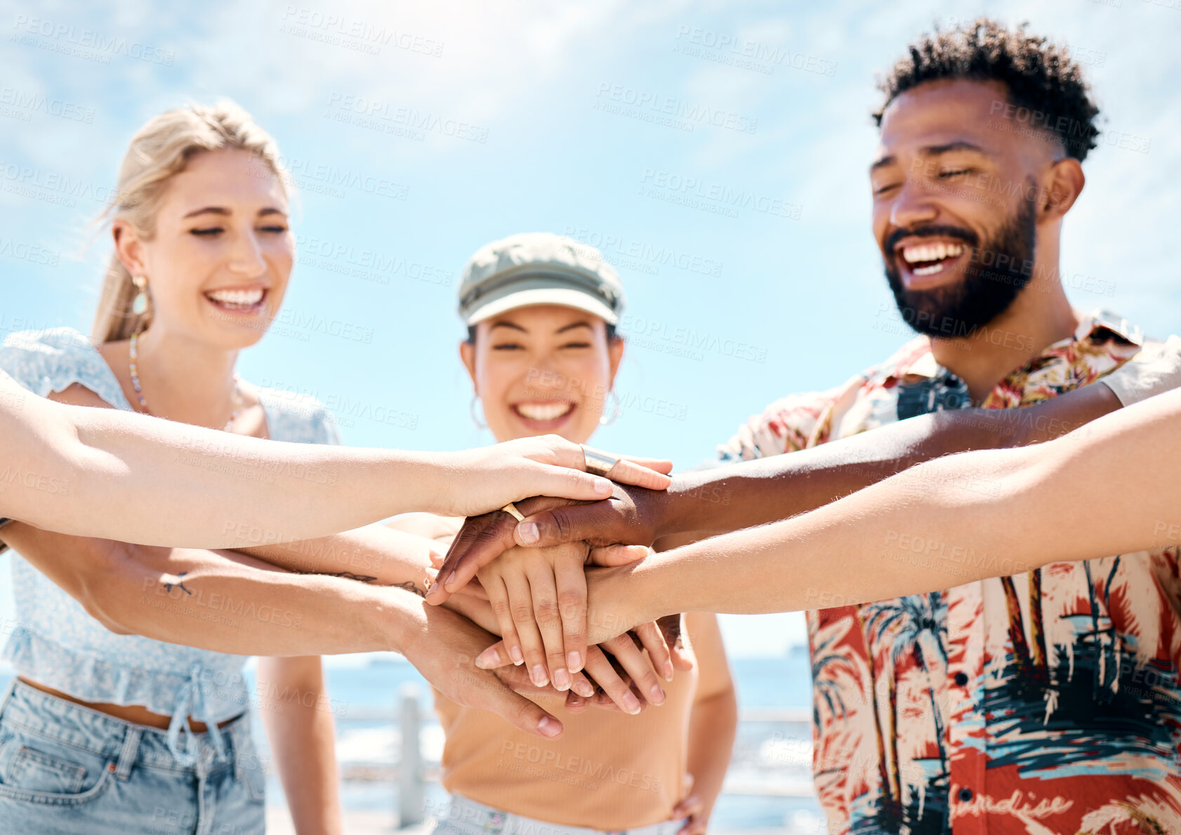 Buy stock photo Smile, hands together and people outdoor for support, community growth and vacation with blue sky. Excited, friends and happy with stack for bonding, social gathering and celebration for reunion