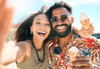 Buy stock photo Cropped portrait of an affectionate young couple taking selfies while enjoying ice creams on the beach