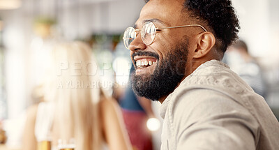 Buy stock photo Shot of a young man enjoying a day at a cafe