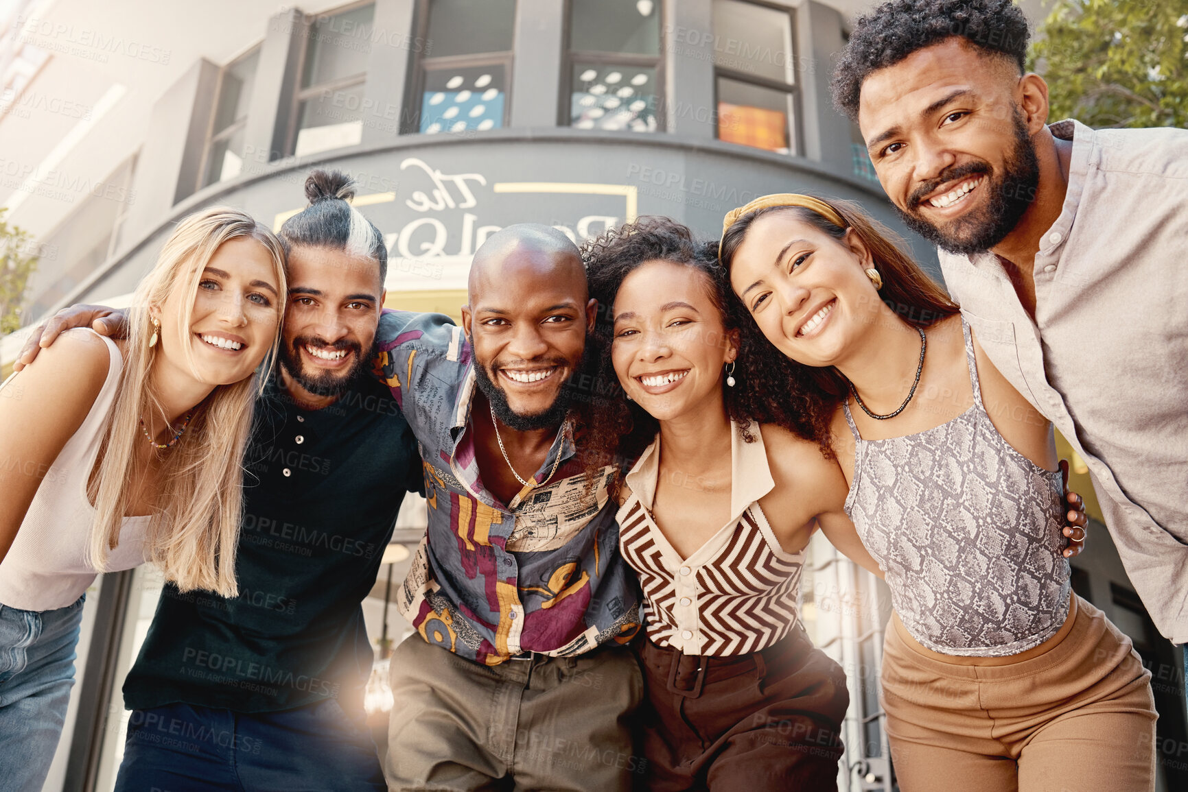 Buy stock photo Shot of a group of young friends taking selfies together at a restaurant