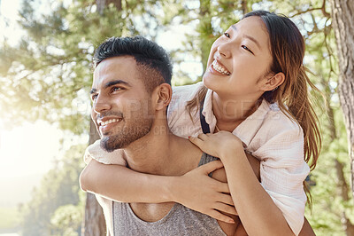 Buy stock photo Hiking, camping or piggyback with a young couple outdoor in nature for romance, dating or exploration. Adventure, smile and love with a man carrying his girlfriend in the forest, woods or wilderness