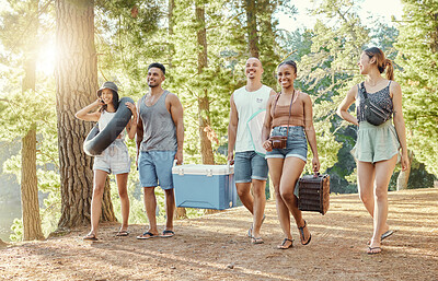 Buy stock photo Group, friends and walking to picnic in the woods, forest or park in nature for summer, vacation and holiday together. Social, diversity and people happy for camping, adventure or outdoor walk