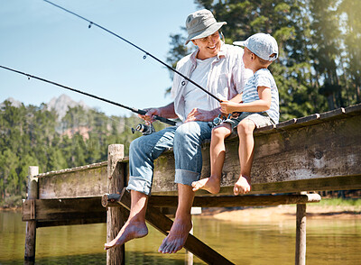 Buy stock photo Grandfather, child and smile for fishing at lake for hobby, adventure and teaching about nature. Boy kid, happy senior man and and learning to fish for fun at river, camping trip and outdoor activity