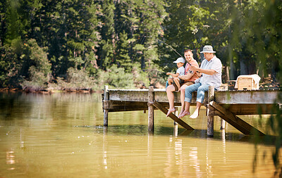 Buy stock photo Father, grandfather and child fishing at lake together for fun bonding or peaceful time in nature outdoors. Dad, grandpa and kid enjoying life, catch or fish with rod by water pond or river in forest