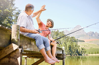Buy stock photo Happy man, father and high five for fishing in lake for successful catch, bonding or winning together in nature. Elderly male person with son in victory, fish or achievement on forest holiday weekend