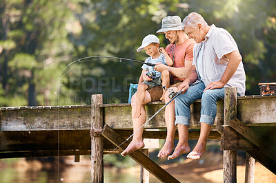 Buy stock photo Dad, grandfather and teaching child fishing at lake together for fun bonding, lesson or activity in nature. Father, grandpa and kid learning to catch fish with rod by water pond or river in forest